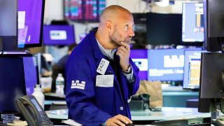 A trader works on the trading floor at the New York Stock Exchange (NYSE) in New York, August 9, 2021.