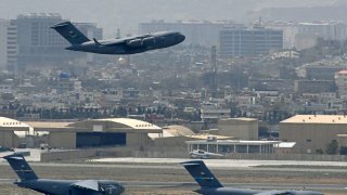 A US Air Force aircraft takes off from the airport in Kabul on August 30, 2021.