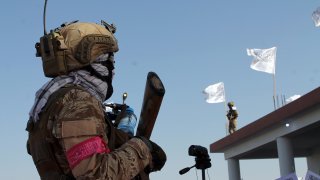 Taliban commando fighters stand guard in Lashkar Gah, Helmand province, southwestern, Afghanistan