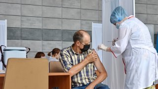 Man receives a COVID-19 vaccine
