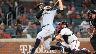 Aaron Judge (99) of the New York Yankees strikes out during the Tuesday evening MLB interleague game between the New York Yankees and the Atlanta Braves on August 24, 2021 at Truist Park in Atlanta, Georgia.