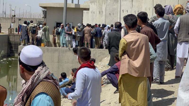 Afghan people who want to leave the country continue to wait around Hamid Karzai International Airport in Kabul, Afghanistan on August 26, 2021.