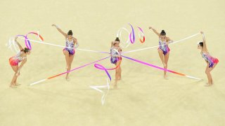 Rhythmic gymnasts group competes