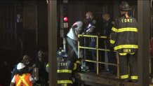 Firefighters evacuated about 300 straphangers from the 4 train late Sunday.