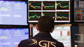 Traders work on the floor of the New York Stock Exchange