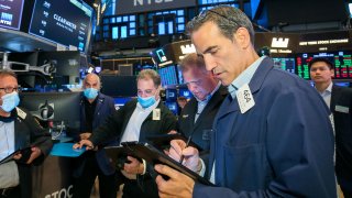Traders on the floor at the NYSE, September 24, 2021.