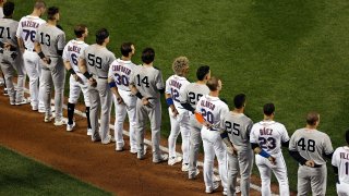 The New York Yankees and the New York Mets lined up