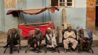 Laborers wait in the street to be hired, in Kabul, Afghanistan, Sunday, Sept. 12, 2021.