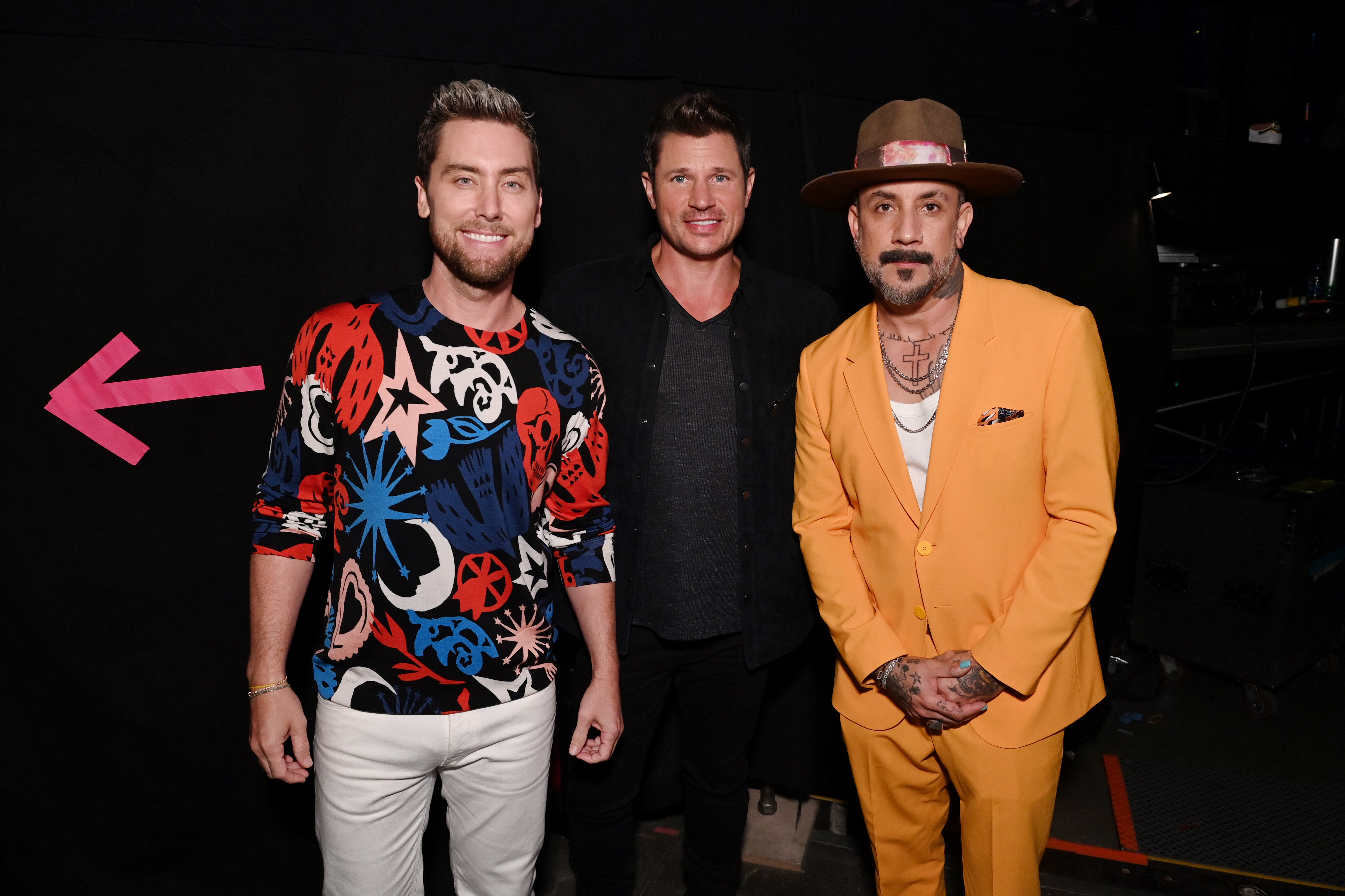 NEW YORK, NEW YORK – SEPTEMBER 12: L-R) Lance Bass, Nick Lachey, and AJ McLean attend the 2021 MTV Video Music Awards at Barclays Center on September 12, 2021 in the Brooklyn borough of New York City.  (Photo by Bryan Bedder/MTV VMAs 2021/Getty Images for MTV/ViacomCBS)