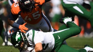 Denver Broncos linebacker A.J. Johnson (45) sacks New York Jets quarterback Zach Wilson (2)