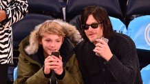 Norman Reedus and Mingus Reedus (L) attend Brooklyn Nets vs New York Knicks at Madison Square Garden on December 2, 2014 in New York City