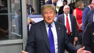 Former President Donald Trump pays a visit to police and firefighters in the 17th precinct on Sept. 11, 2021.