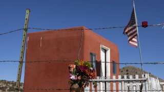 A bouquet of flowers hung on a barb wire near Bonanza Creek Ranch where actor Alec Baldwin fired a prop gun on movie set and killed cinematographer Halyn Hutchin, in Santa Fe, New Mexico, United States on October 24, 2021.