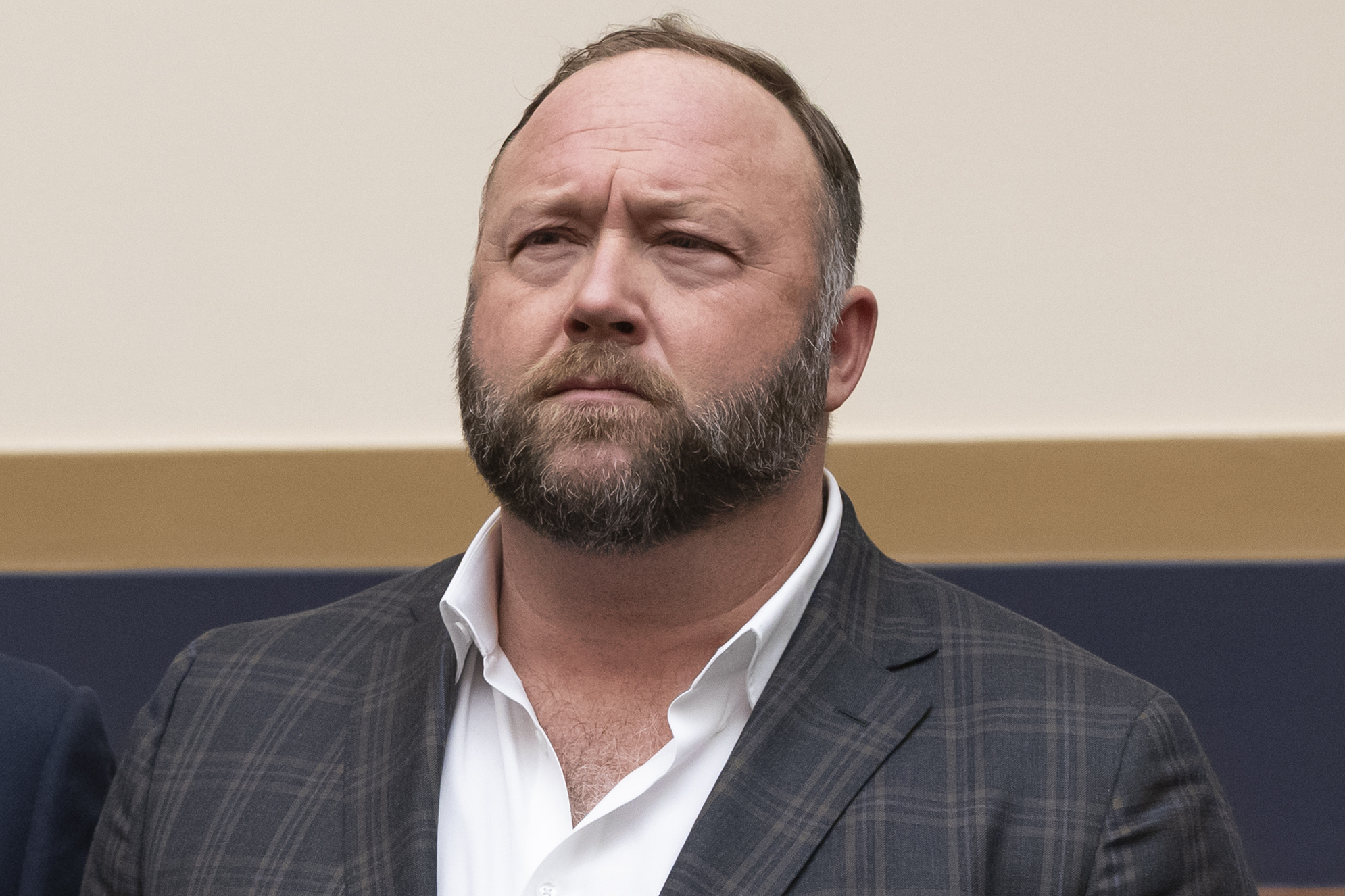 FILE - This Tuesday, Dec. 11, 2018 file photo shows radio show host and conspiracy theorist Alex Jones at Capitol Hill in Washington. On Thursday, April 9, 2020, the U.S. Food and Drug Administration sent a warning letter ordering Jones to stop falsely claiming that toothpaste, mouth wash and other products sponsored by his show can help prevent COVID-19.