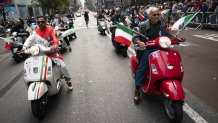 Motorists riding scooters with Italian flags roll up Fifth Avenue during the Columbus Day parade, Monday, Oct. 11, 2021, in the Manhattan borough of New York