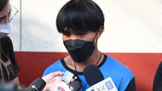 A Myanmar national identified as Song, one of two painters rescued from a high-rise condominium in Thailand, talks to reporters at Pak Kret police station in Nonthaburi near Bangkok, Wednesday, Oct. 27, 2021. A resident of the building cut the support rope for the two painters, apparently angry she wasn't told they would be doing work, and left them hanging above the 26th floor until a couple rescued them, police said Wednesday. The woman is facing charges of attempted murder, according to a police official.