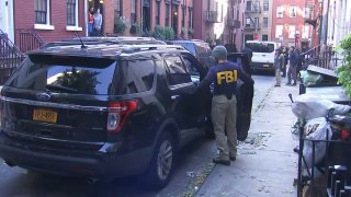 FBI officials outside West Village home