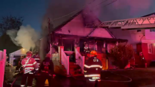 A house in Elmont suffered significant damage after it was fully engulfed in an early morning fire.