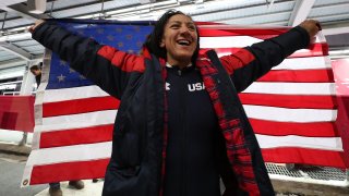 Elana Meyers Taylor holds American Flag