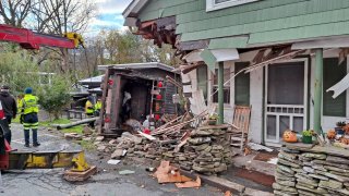 Extensive damage was caused to a Callicoon home after a garbage truck crash.