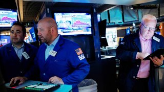 Traders work on the floor of the New York Stock Exchange (NYSE) in New York City, U.S., October 20, 2021.