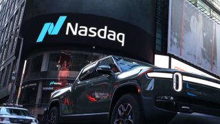 A Rivian electric truck is displayed near the Nasdaq MarketSite building in Times Square on November 10, 2021 in New York City.