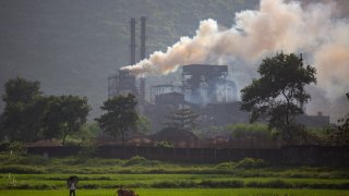 Smoke rises from a coal-powered steel plant