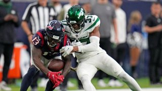 Houston Texans wide receiver Brandin Cooks (13) pulls in a pass against New York Jets cornerback Bryce Hall (37) in the second half of an NFL football game in Houston, Sunday, Nov. 28, 2021