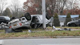 A Toyota Corolla overturned after crashing into a pole in New Hyde Park.