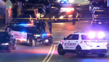 Police block off a Newark road to investigate a quadruple shooting.