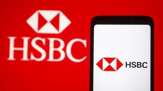 The HSBC logo displayed on a smartphone.