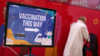 A person enters a mobile coronavirus disease (COVID-19) vaccine clinic during the spread of the Omicron coronavirus variant in Manhattan, New York, U.S., December 7, 2021.