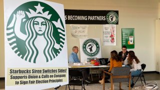 Richard Bensinger, left, who is advising unionization efforts, along with baristas Casey Moore, right, Brian Murray, second from left, and Jaz Brisack, second from right, discuss their efforts to unionize three Buffalo-area stores