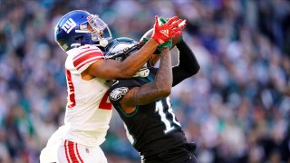 Philadelphia Eagles' Quez Watkins, right, catches a pass against New York Giants' Julian Love during the second half of an NFL football game, Sunday, Dec. 26