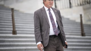 Rep. Thomas Massie, R-Ky., walks down the House steps