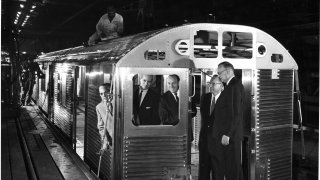 New York City Transit Authority officials inspect the first of their new R32 'Brightliner' subway cars at the Budd Company Railway Division plant in Philadelphia, 10th June 1964.