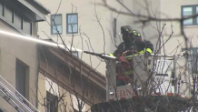 Firefighters put water on a Brooklyn building that prompted a 4-alarm response.