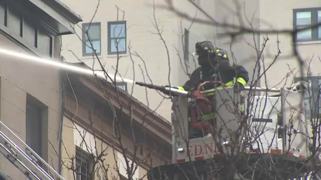Firefighters put water on a Brooklyn building that prompted a 4-alarm response.