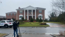 A home in Nassau County is cordoned off by caution tape after a reported shooting early Christmas morning.