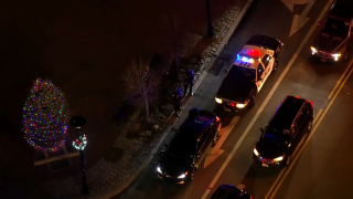 Police surround a vehicle stolen from an alleged carjacker in New Jersey.