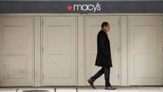 A man walks past a Macy’s department store in Washington, DC.