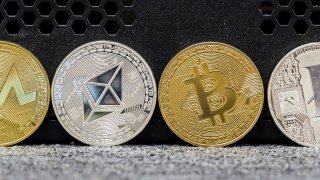 A photo illustration of the digital Cryptocurrency, Litecoin (LTC), Bitcoin (BTC), Ethereum (ETH) and Ripple (XRP) are seen on September 13 2018 in Hong Kong, Hong Kong.