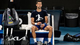 Serbian tennis player Novak Djokovic rests during a training session at Melbourne Park as questions remain over the legal battle regarding his visa to play in the Australian Open in Melbourne, Australia, January 14, 2022.