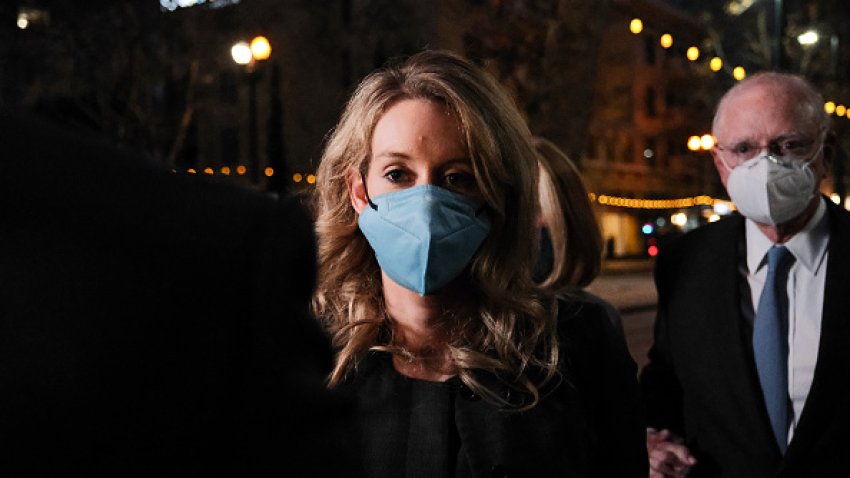 SAN JOSE, CA – JANUARY 3: Theranos founder and former CEO Elizabeth Holmes and her lawyer leave the Robert F. Peckham Federal Building on January 3, 2022 in San Jose, California. A jury found Elizabeth Holmes guilty on three counts of wire fraud and one count of conspiracy to defraud investors.  (Photo by David Odisho/Getty Images)