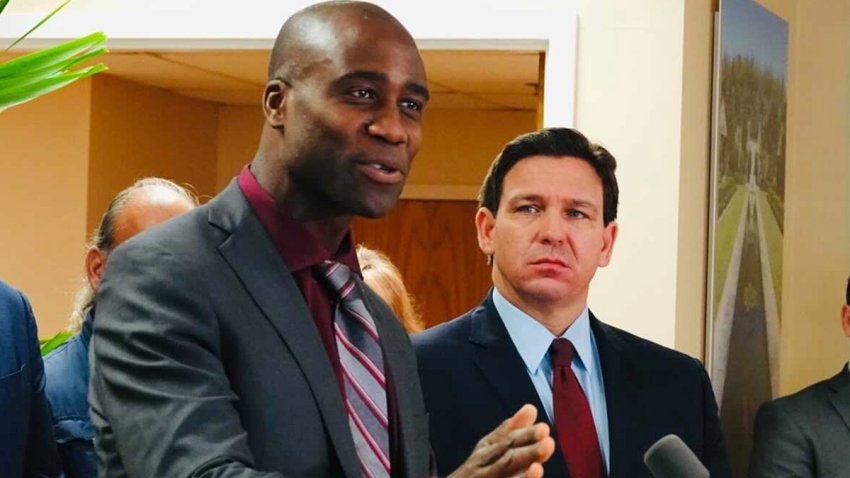 Florida Surgeon General Joseph Ladapo and Gov. Ron DeSantis at a news conference in West Palm Beach, Florida, on Jan. 6, 2022. (Joe Cavaretta/Sun Sentinel/Tribune News Service via Getty Images)