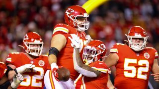 Nick Allegretti #73 of the Kansas City Chiefs celebrates after scoring a touchdown with teammates in the third quarter of the game against the Pittsburgh Steelers in the NFC Wild Card Playoff game at Arrowhead Stadium on January 16, 2022 in Kansas City, Missouri.