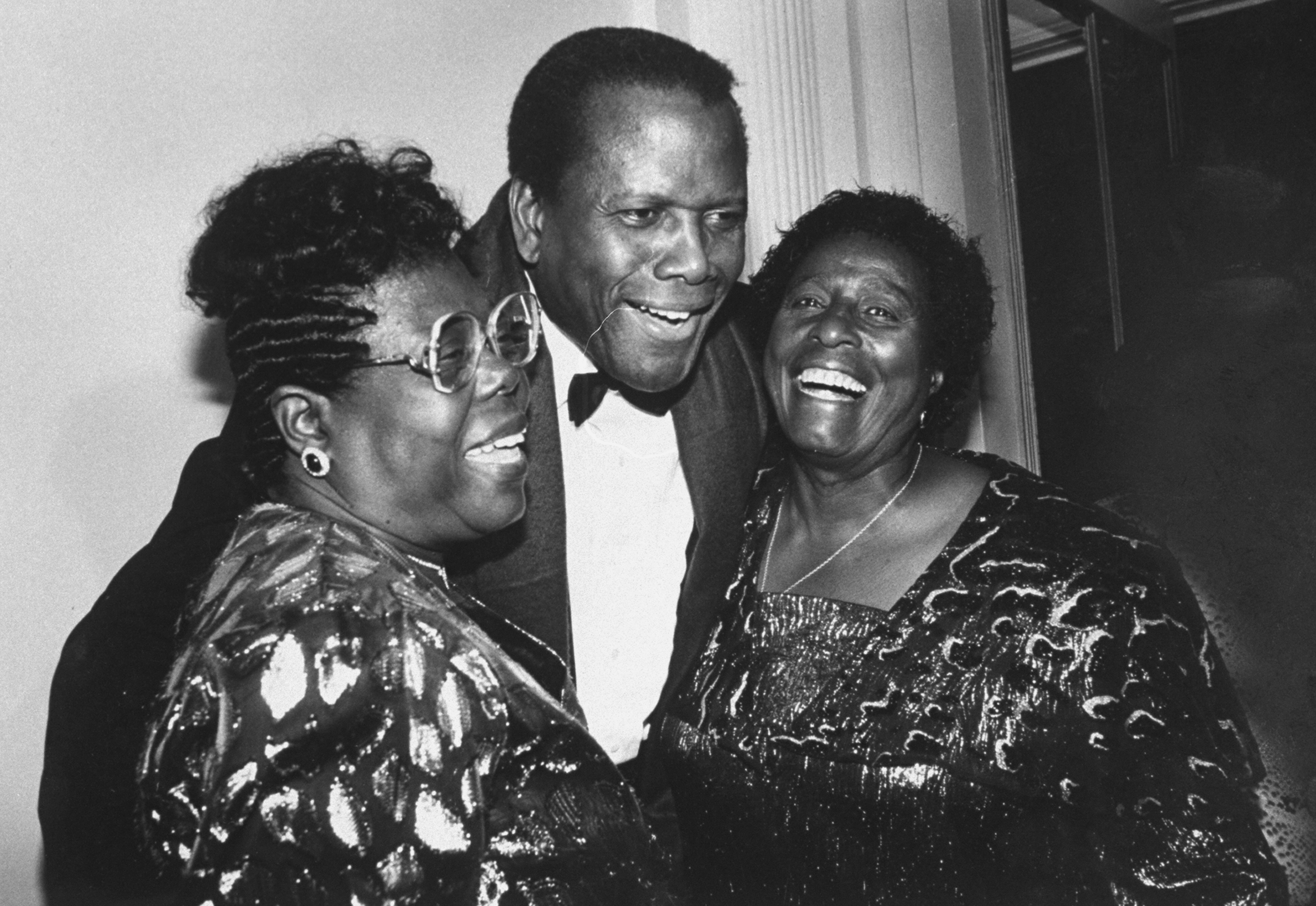 Actor Sidney Poitier, center, with sisters Dolores, left, and Ruby at a tribute to him at the  Museum of the Moving Image, Queens, New York, March 1, 1989.