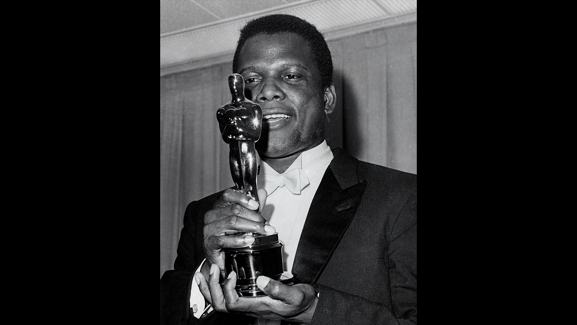 Sidney Poitier holds his Oscar for “Best Actor” for his role in “Lilies of the Field,” 1964. He became the first Black man in history to win an Academy Award.