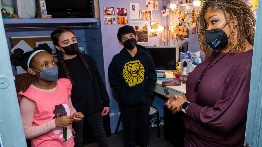Sydney Elise Russell, from left, Alayna Martus and Vince Ermita share Black History Month facts with Bonita J. Hamilton backstage at the Minskoff Theatre