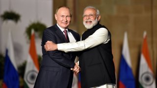 Indian Prime Minister Narendra Modi shakes hands with Russian President Vladimir Putin during their meeting at Hyderabad House, on December 6, 2021 in New Delhi, India.